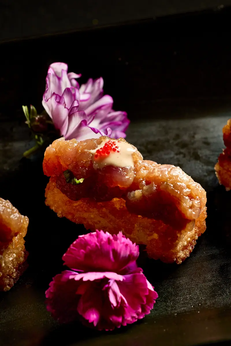 Spicy tuna on crispy rice with flowers