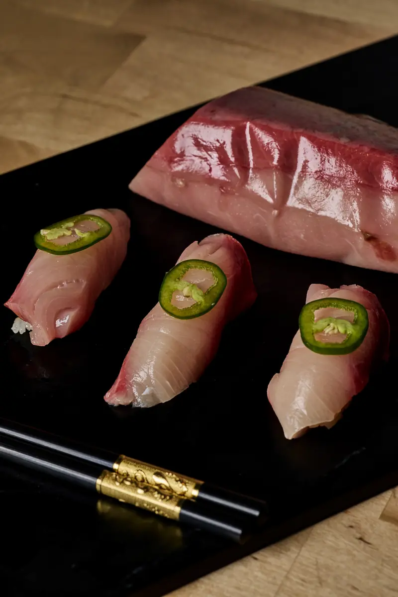 Hamachi nigiri with jalapeƱo