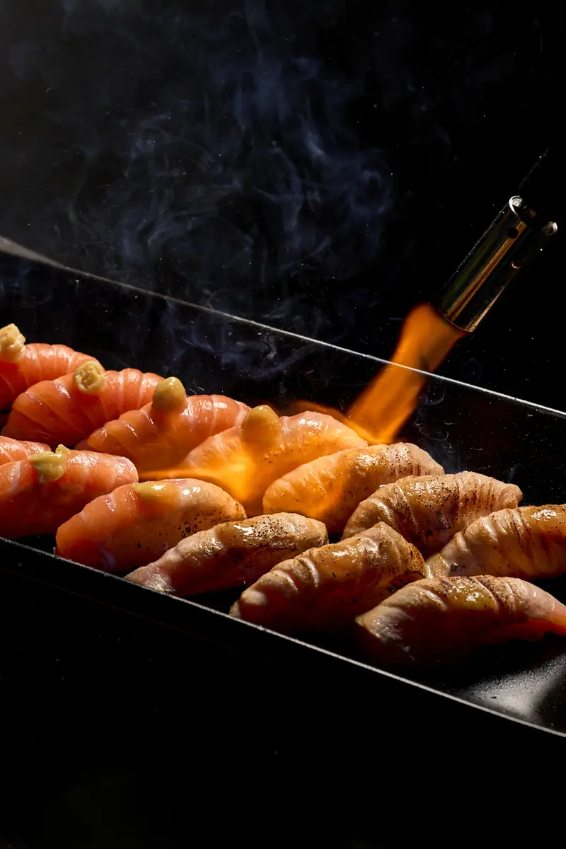 Salmon nigiri being torched